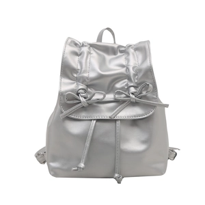 Silver pleated ballet-style backpack with drawstring closure and bow details