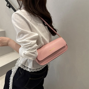 Pink faux leather shoulder bag with gold FASHION & BAGS lettering in a chic style