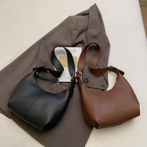 Chic hobo shoulder bags in black and brown matte leather with elegant stitching detail