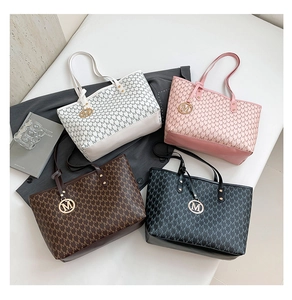 Detailed collection of four large monogram tote bags in white pink coffee and black