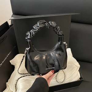 Glossy black pleated cloud bag with stylish silver chain strap and wide top handle