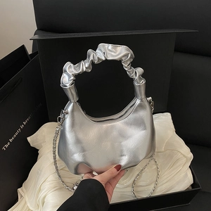Silver metallic pleated handbag with scrunchie handle and stylish chain strap