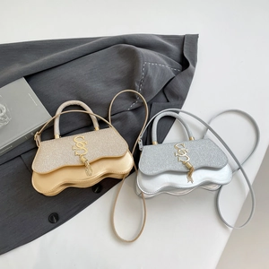 Chic gold and silver crossbody bags with glitter patchwork, metal tassels, and S logo