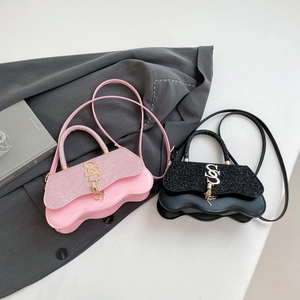 Fashionable pink and black crossbody bags with wave bottom design and tassel charm