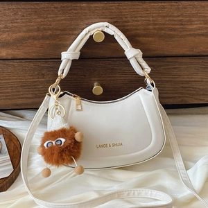 French Niche PU Leather Half Moon Crossbody Bag For Women With Knot Handle And Plush Monster Charm Retro Hobo