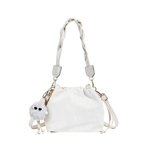 Fashionable cream ruched cloud bucket bag with woven handle and plush monster charm