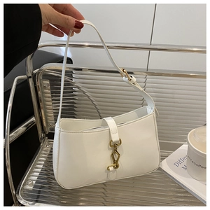 Close-up of vintage white hobo bag with iconic gold piston metal clasp and smooth leather
