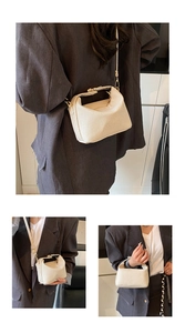 Detail of beige textured crossbody bag showing woven patterns and gold metal hardware