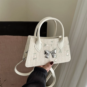 Straw lace mini bag in beige with green floral embroidery and silver bow buckle