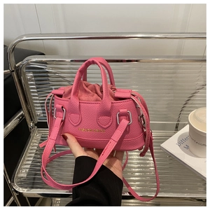 Detail of pink mini shell bag with drawstring liner and fashion letter embossing