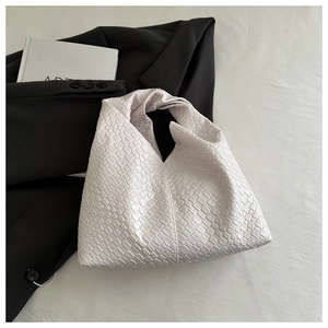 Detail of premium woven texture on creamy white large capacity hobo shoulder tote bag