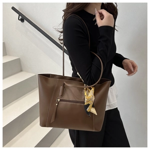 Brown large capacity tote bag with decorative silk scarf on the shoulder strap