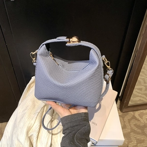 Chic smog blue mini square handbag with textured finish and golden hardware locks