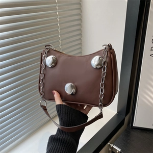 Brown rivet shoulder bag with silver round buckles and chain strap, hand-held display