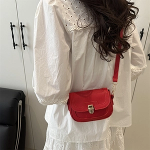 Chic red faux leather crossbody bag with gold lock and textured lychee finish for women