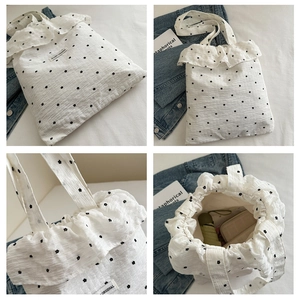 Detailed views of a white ruffled floral tote bag showing its large interior and fabric