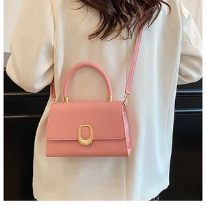Detailed back view of a pink PU leather crossbody bag featuring a golden metal buckle