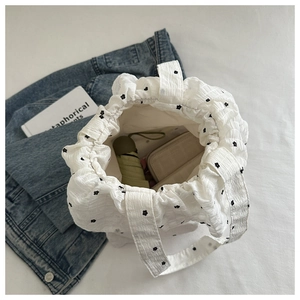 Detailed macro view of crinkle fabric floral tote bag with spacious inner storage