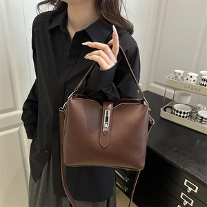 Classic dark brown bucket bag with metal lock and shoulder strap for women