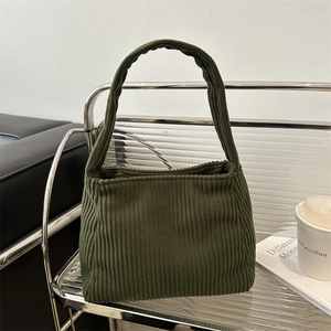 Olive green corduroy shoulder bag with vertical texture and sturdy wide handles