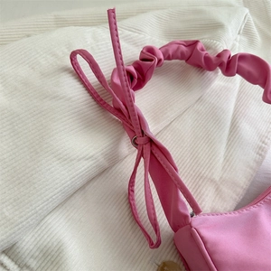 Pink bow shoulder bag with scrunchie strap and minimalist square design for women
