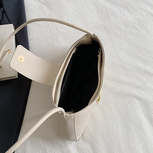 Creamy white fashion underarm bag with gold magnetic buckle and interior zipper pocket