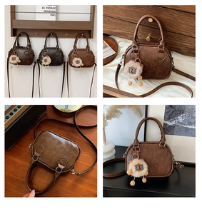 Close-up of LUCKY embossed detail and plush sheep charm on vintage bowling crossbody bags