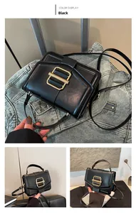 Detail of black crossbody bag featuring a minimalist golden rectangular metal buckle