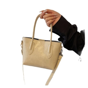 Minimalist cream tote bag with large capacity and adjustable strap for women