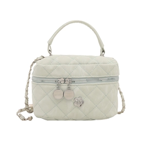 Light green quilted box bag with silver chain strap and flower charm in minimalist style