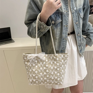 Lace straw tote bag with floral embroidery and bow detail for summer shopping style