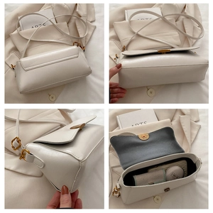 Détails du sac bandoulière en cuir blanc cassé avec fermoir doré et espace intérieur
