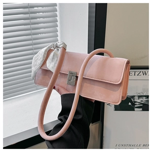 Pink matte shoulder bag detail with sparkling crystal buckle and silk scarf strap decor