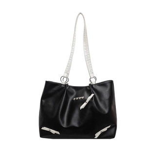 Fashionable black and white contrast tote bag with metal hearts and white bows decoration