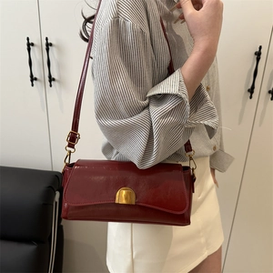 Fashionable dark red leather rectangular shoulder bag with vintage gold buckle closure