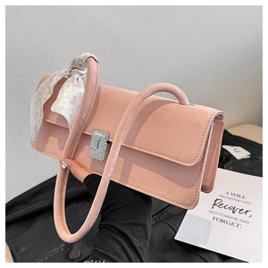Detail of light pink shoulder bag with silk scarf handle and diamond metal S buckle