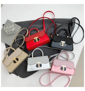 Flat lay of small crossbody bags in five colors with sequin flaps and metal locks