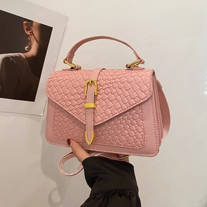Pink woven embossed handbag with golden hardware and shoulder strap in lady style