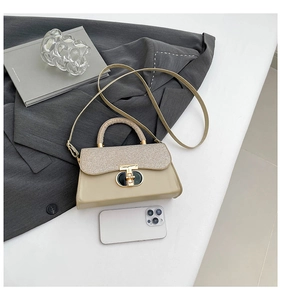 Detail of mini beige tweed and leather crossbody bag featuring gold T-lock and smartphone