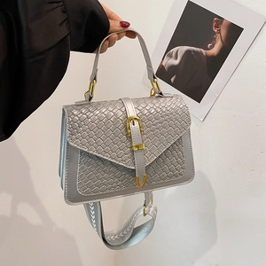 Silver-grey woven texture handbag with golden buckle and patterned shoulder strap