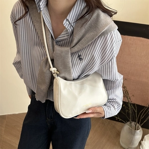 White glossy faux leather half-moon shoulder bag with minimalist metallic logo detail