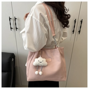 Pink twill tote bag with a silver chain strap and a cute cloud plush charm detail