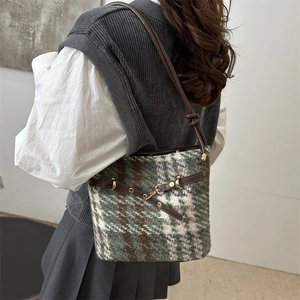 Retro plaid bucket bag with green tweed texture and brown leather shoulder strap