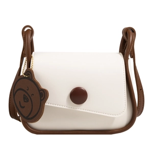 Minimalist cream and brown contrast mini square crossbody bag with a cute bear charm