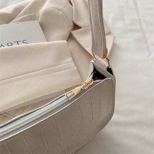 Chic white crocodile pattern shoulder bag with premium gold hardware and minimalist design