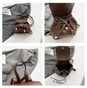 Detail of vintage plaid backpack with drawstring closure and golden FASHION logo