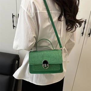 Bright green crossbody flap bag with textured weave and silver turn-lock closure