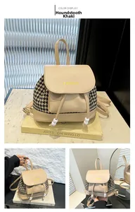 Detail of khaki houndstooth backpack showing PU leather patchwork and drawstring closure