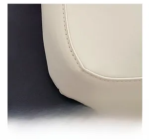 Detail view showing precision stitching and textured white leather on the crescent bag