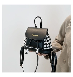 Detail of houndstooth backpack with leather flap and gold FASHION lettering